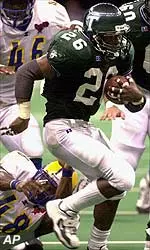 Mewelde Moore runs past Southern defenders for a first down during the first half.