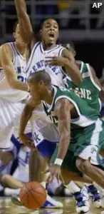 Kentucky's Cliff Hawkins lets out a yell as he tries to draw a charge from Tulane's Brandon Spann during the first half of their game Wednesday. No foul was called on the play.