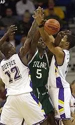 Brandon Brown tries to pass from in between LSU's Ronald Dupree, left, and Jaime Lloreda.