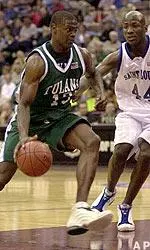Linton Johnson drives to the basket against Saint Louis' Jason Edwin in the first half, Wednesday.