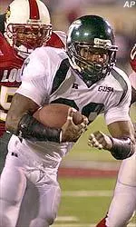 Mewelde Moore gets away from Louisville defenders during the second quarter.
