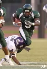 Roydell Williams fights for yardage Saturday against Northwestern State.