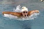 Taylor Emerson posted victories in the 100-yard backstroke, 200-yard backstroke and the 400-yard individual medley, and helped lead the 200-yard medley relay team to a win Friday evening at Spring Hill.