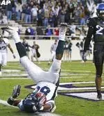 Tulane's Chris Bush falls backward in the end zone as TCU's Jeremy Modkins looks on, after Bush caught a quick pass from quarterback Richard Irvin with seconds left in the game, for the go-ahead touchdown. (AP Photo/Fort Worth Star-Telegram, Paul Moseley)