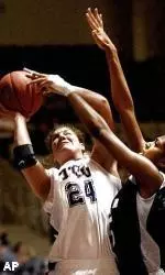 TCU's Niki Newton shoots against Tulane's Cashmir White during the first half.
