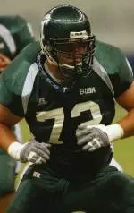 Matt Traina and the Green Wave collide with Marshall on Saturday at Ladd-Peebles Stadium in Mobile, Alabama.