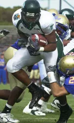 Matt Forte struggles against Tulsa linebacker Nelson Coleman, behind, and defensive back Bobby Klinck (26). (AP Photo/The News-Star, Michael Dunlap)