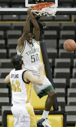 Quincy Davis dunks over Valparaiso's Dan Oppland. (AP Photo/Charlie Neibergall)