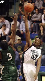 Qunicy Davis reaches for the opening tip against Charlotte's Curtis Withers (3) in college basketball action in New Orleans, Saturday, Feb. 19, 2005.