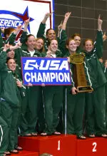 Members of the Tulane swimming & diving team celebrate atop the podium at the 2005 Conference USA Championship.