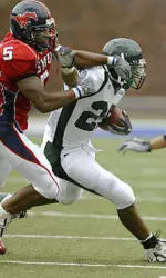 Matt Forte tries to slip past SMU defenders during the first quarter.
