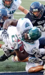 Senior running back Ade Tuyo and the Green Wave football team wrap up year one of the "Bob Toledo Era" Saturday at East Carolina.