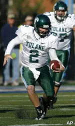 Kevin Moore runs away from pressure from Tulsa's Mike Bryan. (AP Photo/David Crenshaw)