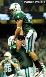 Senior wide receiver Casey Robottom celebrates his second touchdown of the day with sophomore right tackle Eric Jones in the fourth quarter of Saturday's Homecoming contest against Army.
