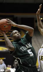 Tulane guard Jordan Callahan (5) shoots while falling back as Southern Mississippi guard Maurice Bolden (1) defends during the first half of an NCAA college basketball game in Hattiesburg, Miss., Tuesday, March 2, 2010. (AP Photo/Steve Coleman)
