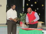Julius Warmsley receives the Top Scholar Award from Fellowship Foundation founder and President Mr. Charles Alexander.