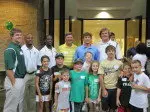Members of the Tulane Football team pose with fans during the TAF Summer Camp Event.