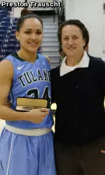 Senior wing Janique Kautsky accepts her award from Northern Arizona University Senior Woman Adiministrator Beth Vichinski after being named MVP of the Hilton Garden Inn Thanksgiving Tournament.