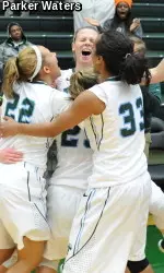 Teammates mob junior guard Danielle Blagg after she hit the game-winning 3-pointer in Tulane's 73-71 overtime victory against Conference USA rival Southern Miss.