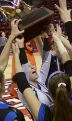Libero Lisa Mordell celebrates with her teammates following St. Francis High's Illinois 3A Championship Match victory.