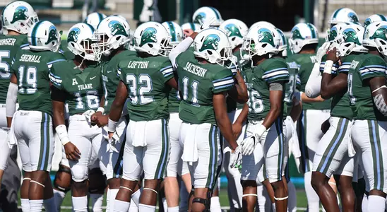 Football Team Huddle vs. SMU