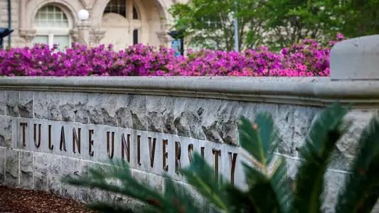 gibson hall tulane university sign with flowers