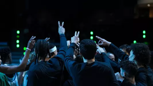 Tulane men's basketball in a pregame huddle.