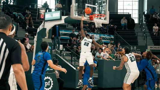 Asher Woods shoots reverse layup against Memphis on March 8.