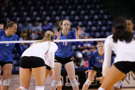 volleyball player hitting a volleyball