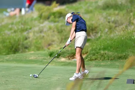 Greta Bruner hitting a golf ball
