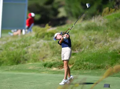 Greta Bruner hitting a golf ball