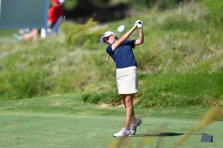 Greta Bruner hitting a golf ball
