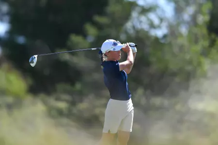 Greta Bruner hitting a golf ball