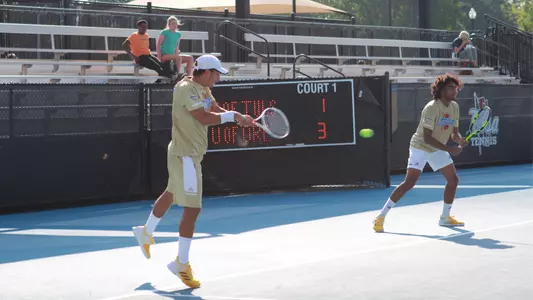 men's tennis player hitting the ball