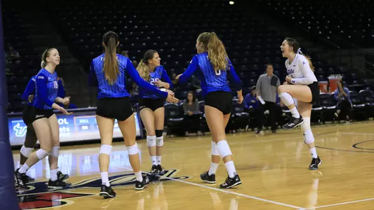 volleyball players celebrating