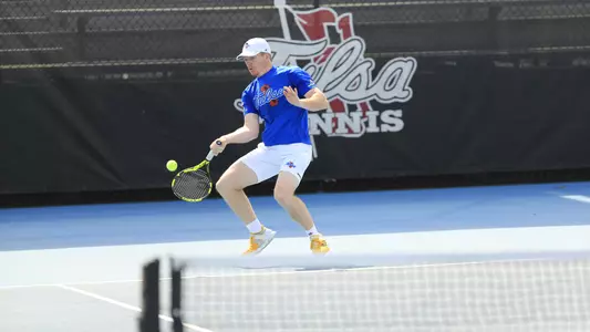 men's tennis player hitting the ball