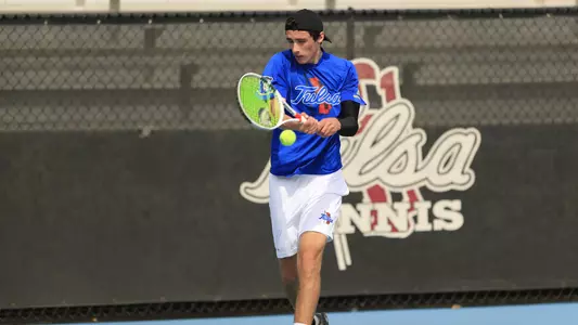 men's tennis player hitting the ball
