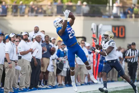 Tulsa's wide receiver Justin Hobbs (left) pulls down a pass as Navy's cornerback Tyris Wooten defends during the game at H.A. Chapman Stadium in Tulsa, OK on 9/30/17. BRETT ROJO/For the Tulsa World