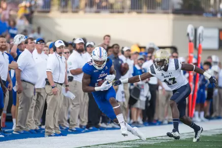 Tulsa's wide receiver Justin Hobbs (left) makes the catch and stays inbounds as Navy's cornerback Tyris Wooten moves in during action at H.A. Chapman Stadium in Tulsa, OK on 9/30/17. BRETT ROJO/For the Tulsa World