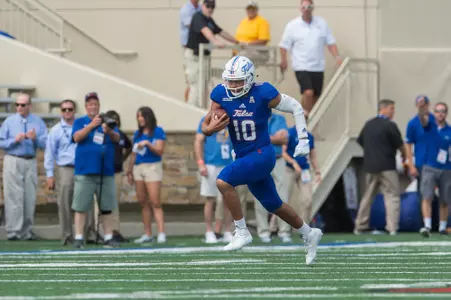 Tulsa's quarterback Chad President runs for a big gain during the game against Navy at H.A. Chapman Stadium in Tulsa, OK on 9/30/17.  BRETT ROJO/For the Tulsa World
