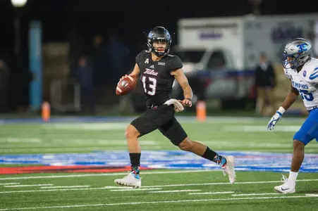 Tulsa's quarterback Luke Skipper (13) is chased out of the pocket by Memphis' linebacker Tim Hart (35) during the game against at H.A. Chapman Stadium in Tulsa, OK on 11/3/17. BRETT ROJO/For the Tulsa World