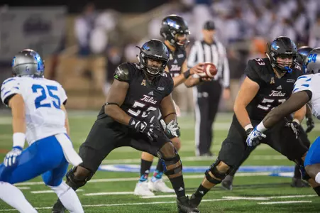 Tulsa's offensive tackle Willie Wright (center) blocks during the game against Memphis at H.A. Chapman Stadium in Tulsa, OK on 11/3/17. BRETT ROJO/For the Tulsa World