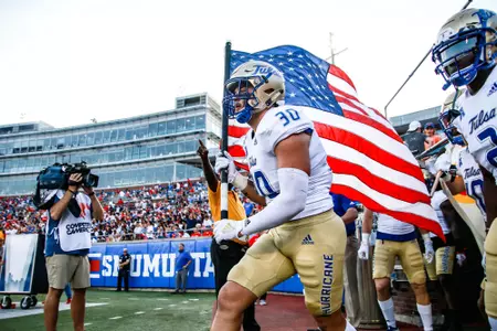 Justin Wright leads team out with American flag