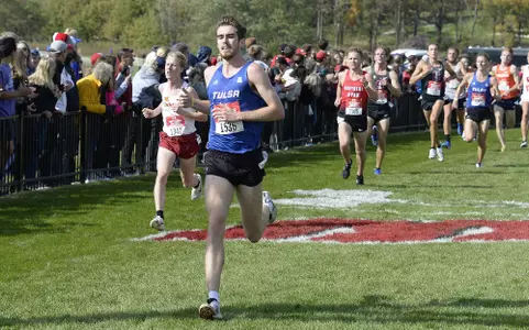 Isaac Akers crossing the finish line