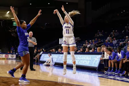 Maddie Bittle playing basketball