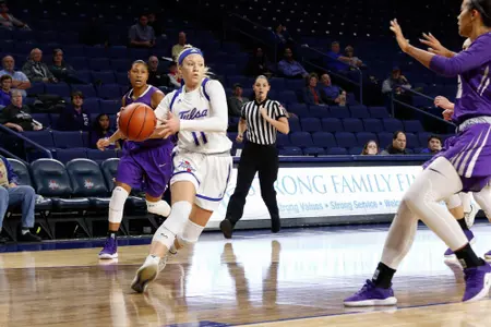 Maddie Bittle playing basketball