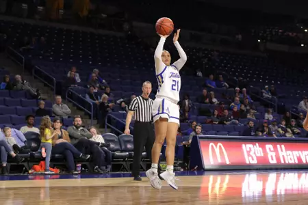 Rebecca Lescay playing basketball