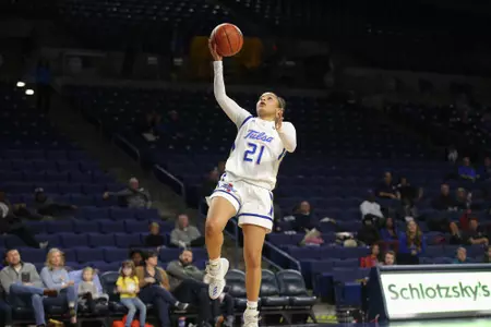 Rebecca Lescay playing basketball