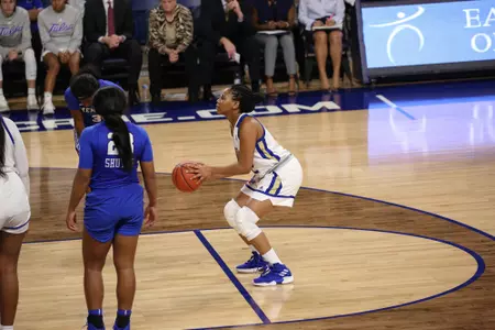 Desiree Lewis playing basketball