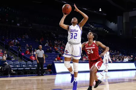 Desiree Lewis playing basketball